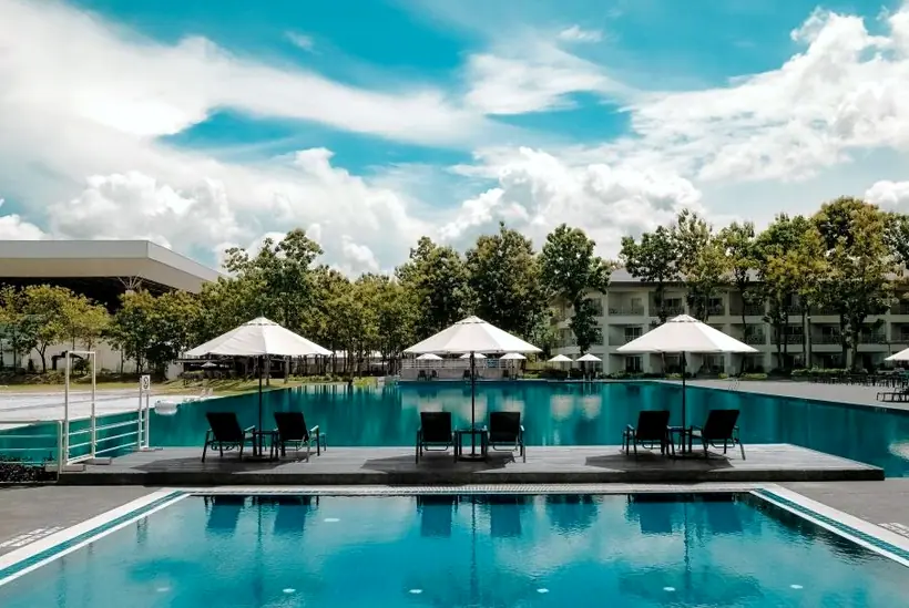 An outdoor pool with white parasols