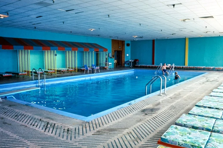 A spacious indoor pool with lane lines